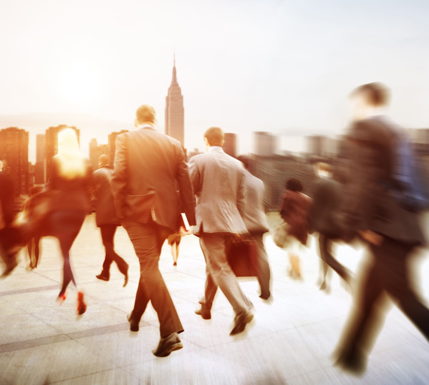 Men in suits walking quickly